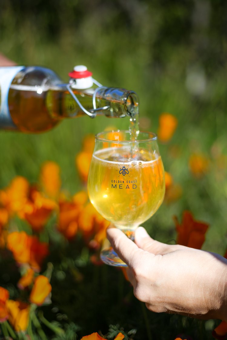 Mead being poured into a Golden Coast Mead glass